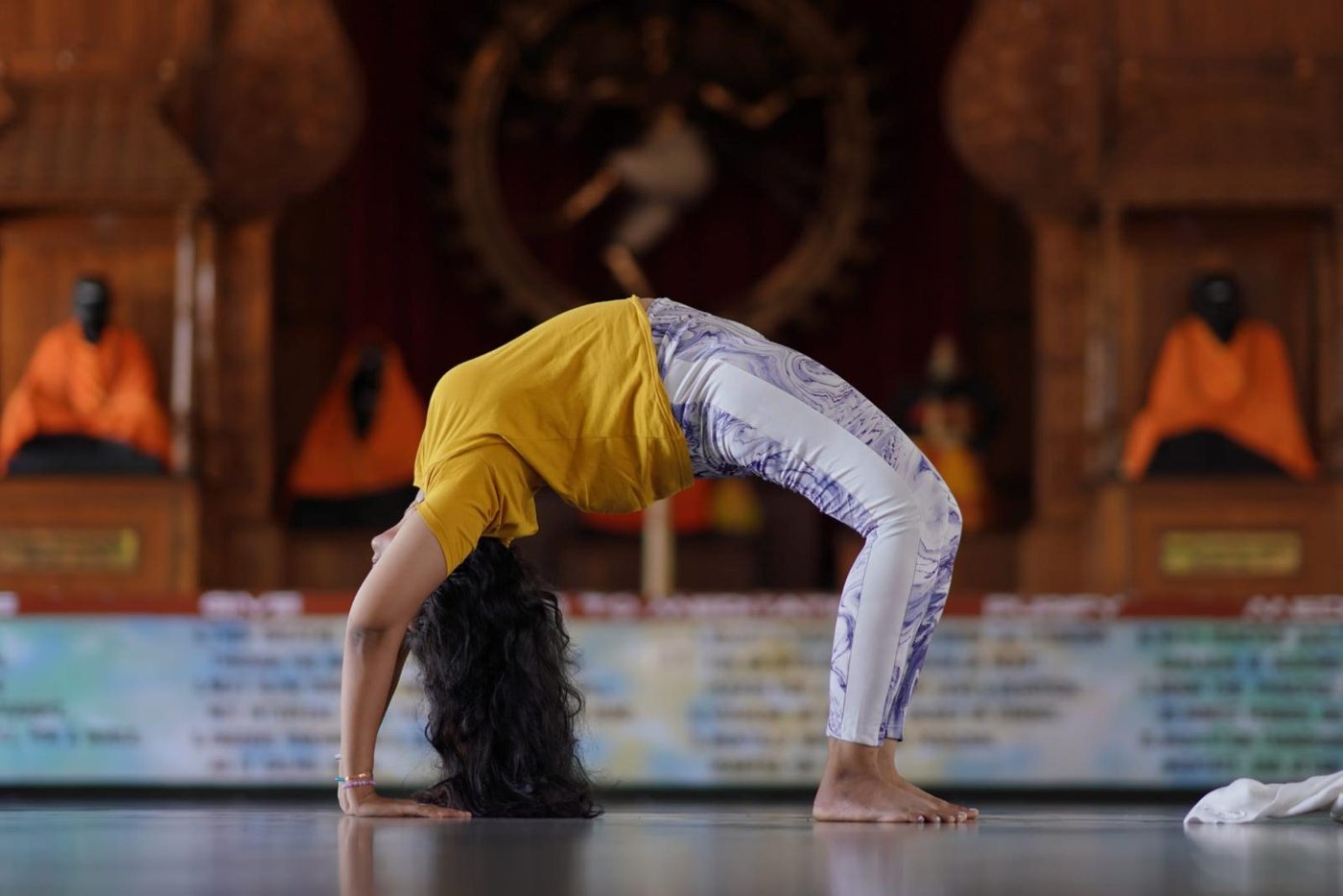 Sreepriya performing wheel pose (Chakrasana)